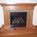 Traditional Style Fireplace with Stone and Wood