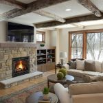 Stone fireplace with TV above
