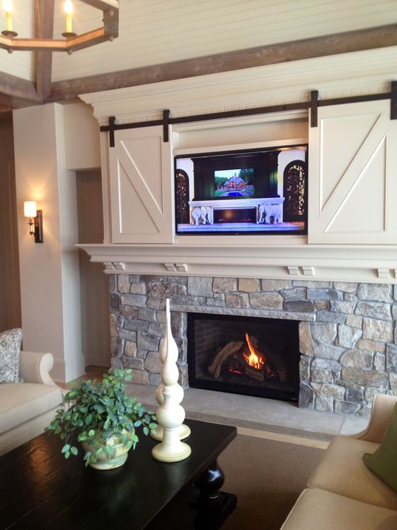 fireplace with white cabinets above.jpg