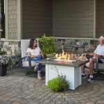Outdoor Greatroom fire table with white base and stone grey top