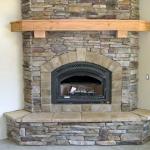 Stone fireplace with mantel, installation by La Crosse Fireplace