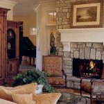 Rustic stone fireplace with mantel by La Crosse Fireplace