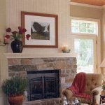 Stone fireplace with mantel, design installation by La Crosse Fireplace