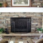 Stone fireplace with wood mantel. La Crosse Fireplace
