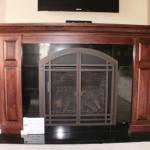 Traditional Style Fireplace with Tile, Glass & Wood