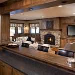 Rustic family room stone fireplace by La Crosse fireplace