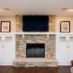 Family room stone fireplace with mantel, installation by La Crosse Fireplace