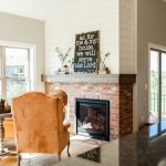 Brick fireplace with mantel & shiplap