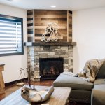 Corner angle fireplace with mantel & barn board above