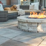 Custom outdoor gas firepit with stone façade and limestone top