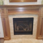 Heat & Glo 6000CL Gas Fireplace with Travertine tile and custom mantel surround