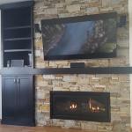 Kozy Heat Slayton 42 Gas Fireplace with Hudson Ledgestone and custom mantel with cabinetry
