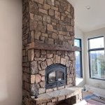 Heatiltor C40 wood fireplace with custom real stone veneer