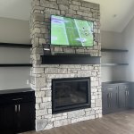 Heat-n-Glo 8KX gas fireplace with real stone veneer custom surround
