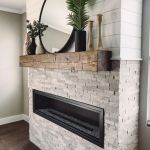 Stack stone with barn beam mantel