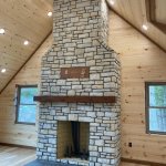 Rutherford wood fireplace with Fond du lac Country Squire stone