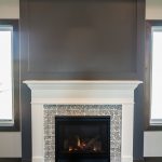 Heat-n-Glo gas fireplace with traditional white mantel surround and mosaic tile
