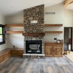Palermo Del mar ledgestone with custom mantel and cabinets from Colby Cabinetry